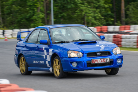 Driving behind the wheel of a Subaru Impreza on the track (4 laps)