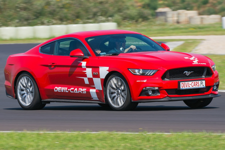 Driving behind the wheel of a Ford Mustang around the track (3 laps)